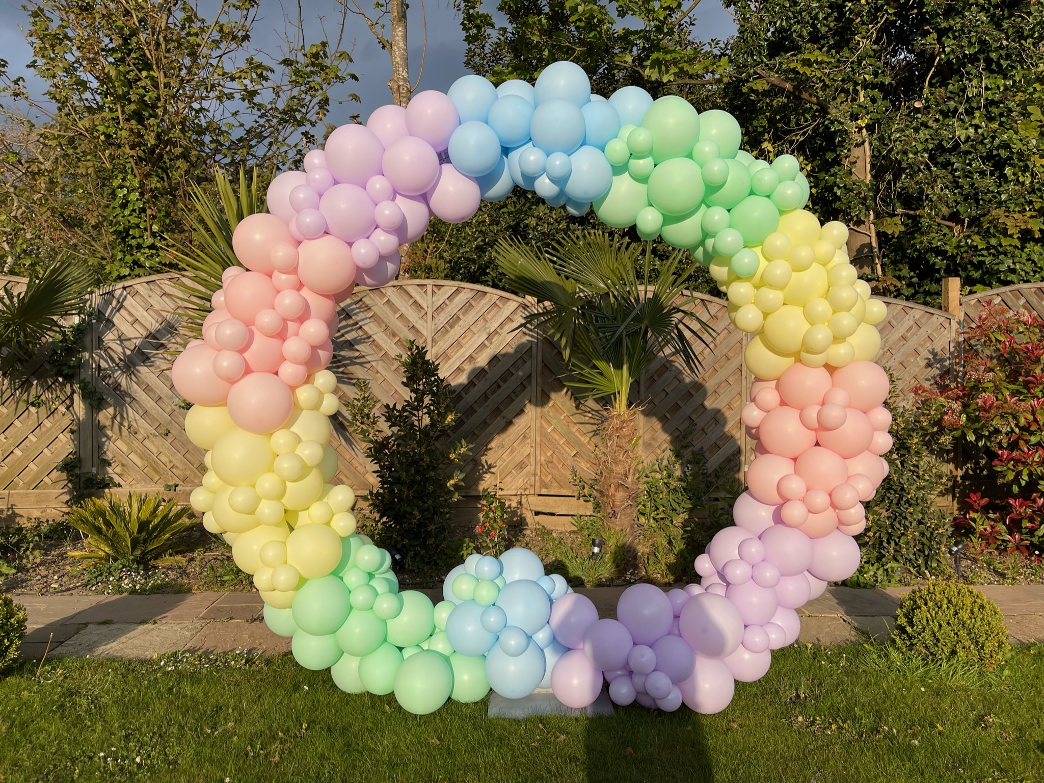 Circle of pastel colored balloons