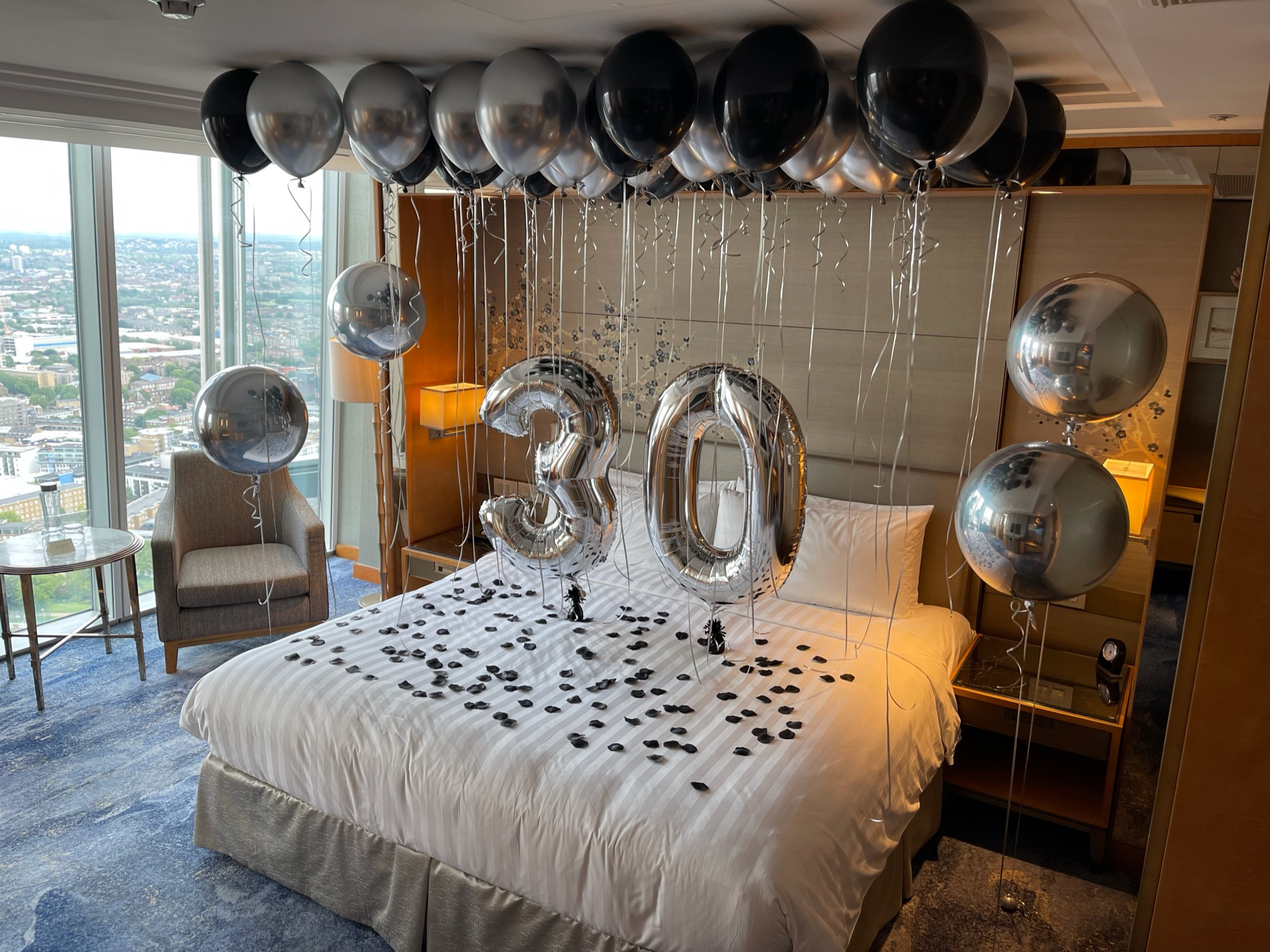 Hotel room decorated with number 30 balloons 2